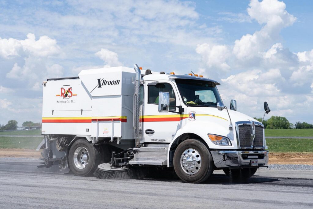 Mechanical street sweeper XBroom used on road construction site